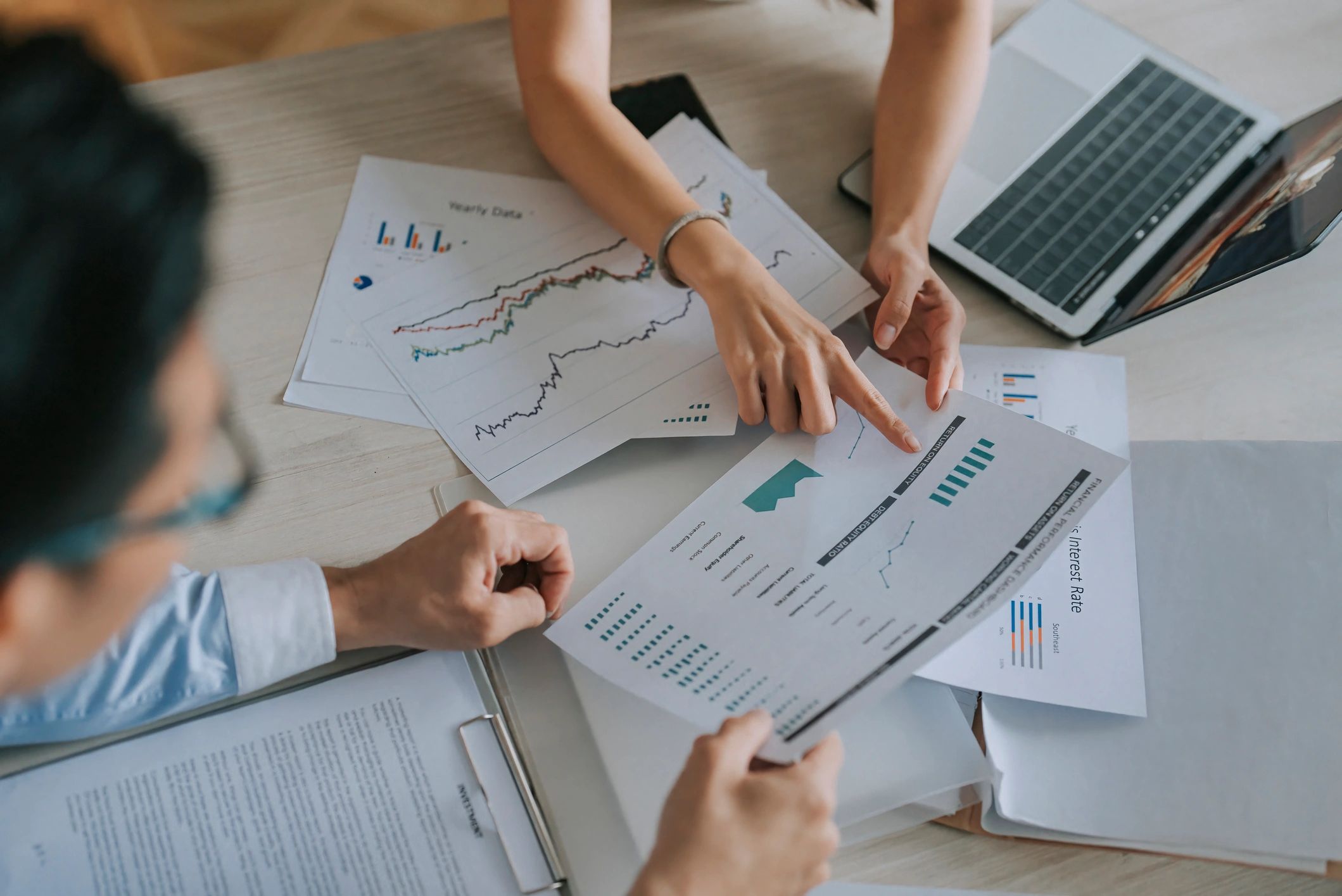 Financial planning and record-keeping documents on desk